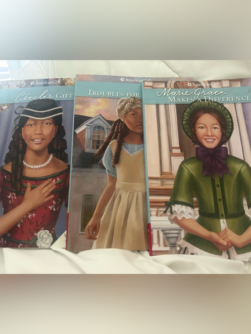 American Girl book set – teal, green, red